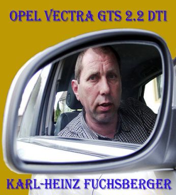Heinz Fuchsberger im Außenspiegel seins Opel Vectra GTS. 